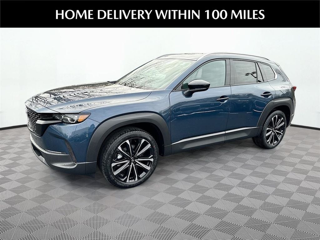 2026 Mazda Mazda CX-50 2.5 S Premium AWD in Ingot Blue Metallic — front three-quarter view