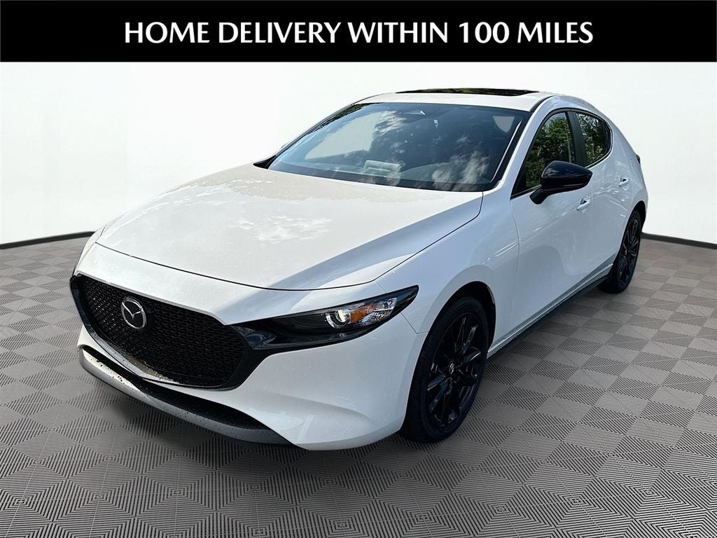 2026 Mazda Mazda3 Hatchback 2.5 S Carbon Edition AWD in Snowflake White Pearl — front three-quarter view