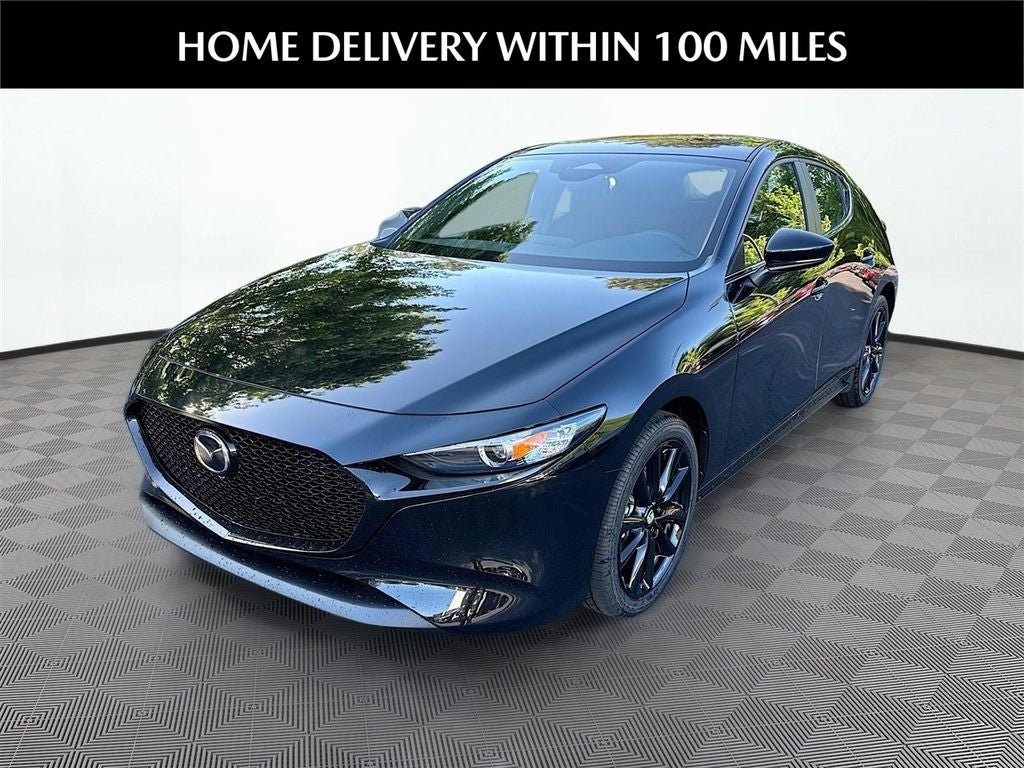 2026 Mazda Mazda3 Hatchback 2.5 S Carbon Edition AWD in Jet Black Mica — front three-quarter view