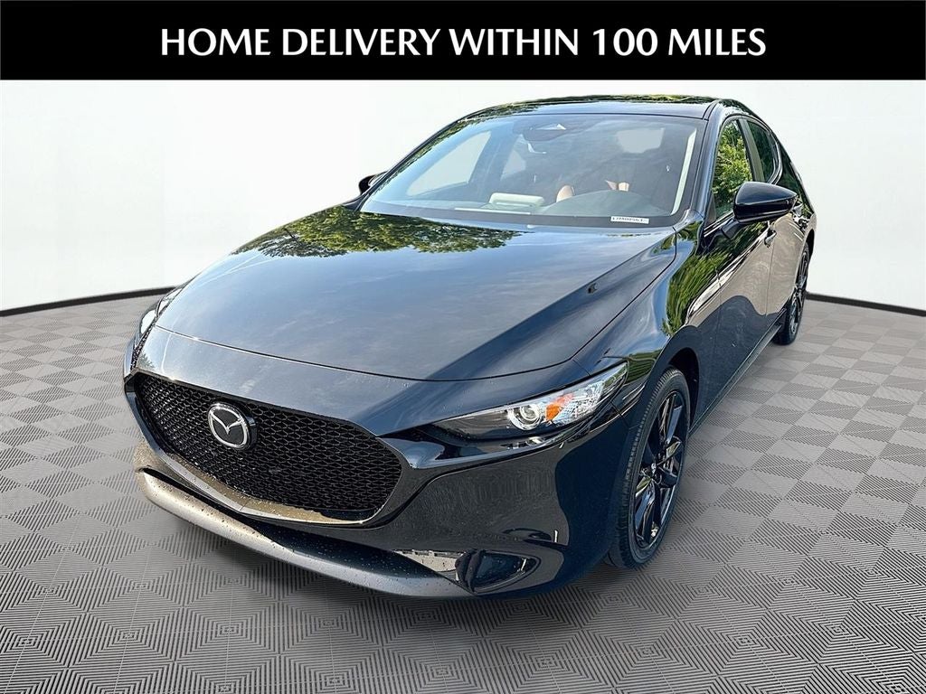 2026 Mazda Mazda3 Hatchback 2.5 S Carbon Edition AWD in Jet Black Mica — front three-quarter view
