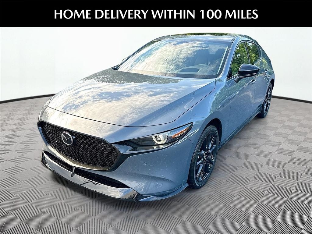 2026 Mazda Mazda3 Hatchback 2.5 Turbo Premium Plus AWD in Polymetal Gray Metallic — front three-quarter view