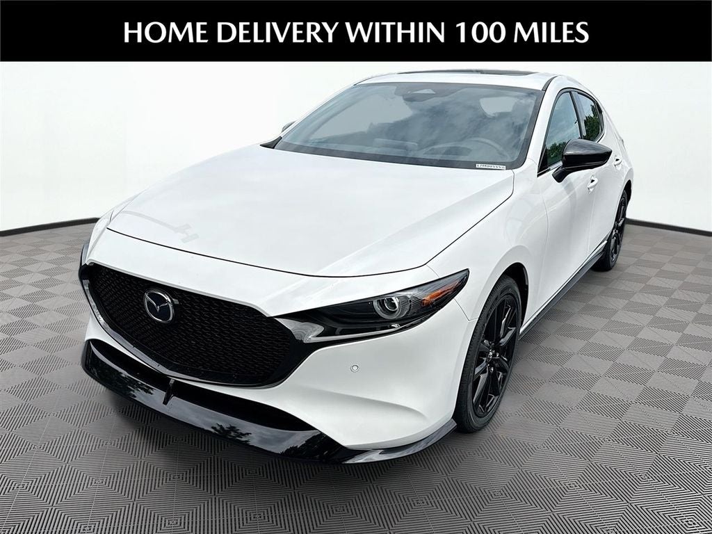 2026 Mazda Mazda3 Hatchback 2.5 Turbo Premium Plus AWD in Snowflake White Pearl — front three-quarter view