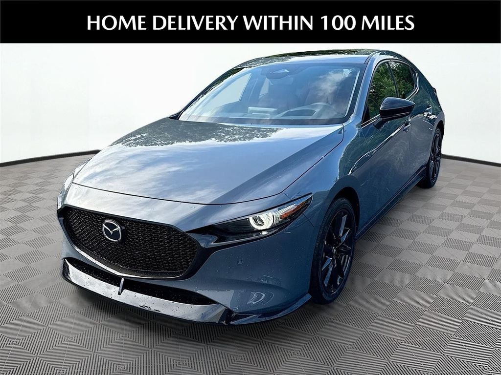 2026 Mazda Mazda3 Hatchback 2.5 Turbo Premium Plus AWD in Polymetal Gray Metallic — front three-quarter view