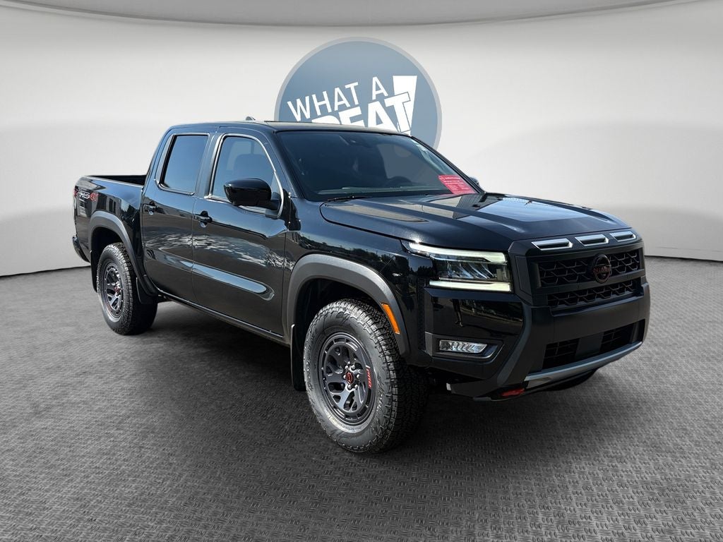 2025 Nissan Frontier PRO-4X in Super Black — front three-quarter view