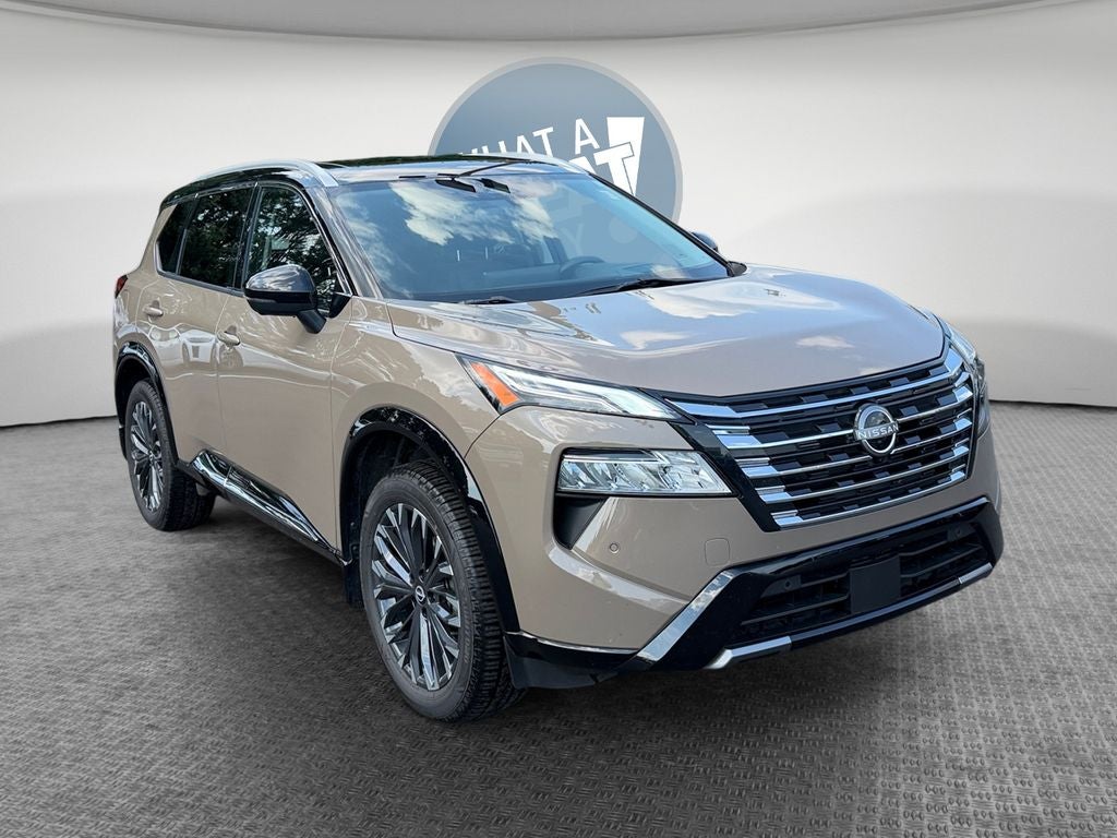 2024 Nissan Rogue Platinum in Baja Storm Metallic/Super Black — front three-quarter view