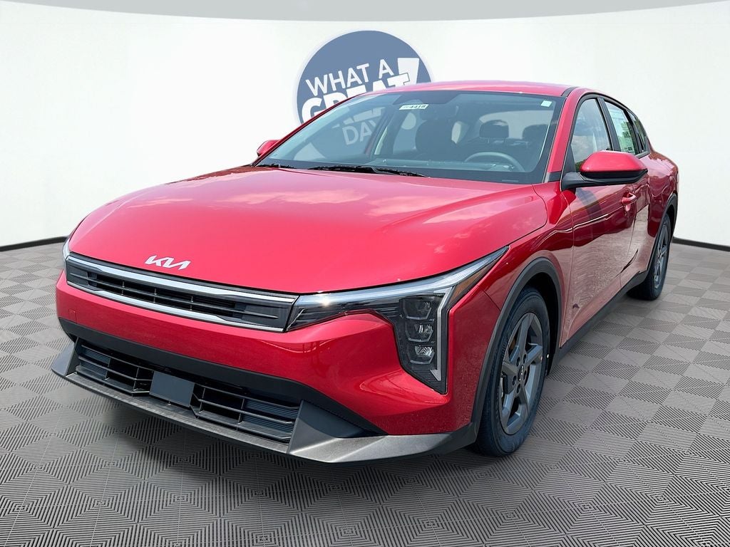 2026 Kia K4 LXS in Currant Red — front three-quarter view