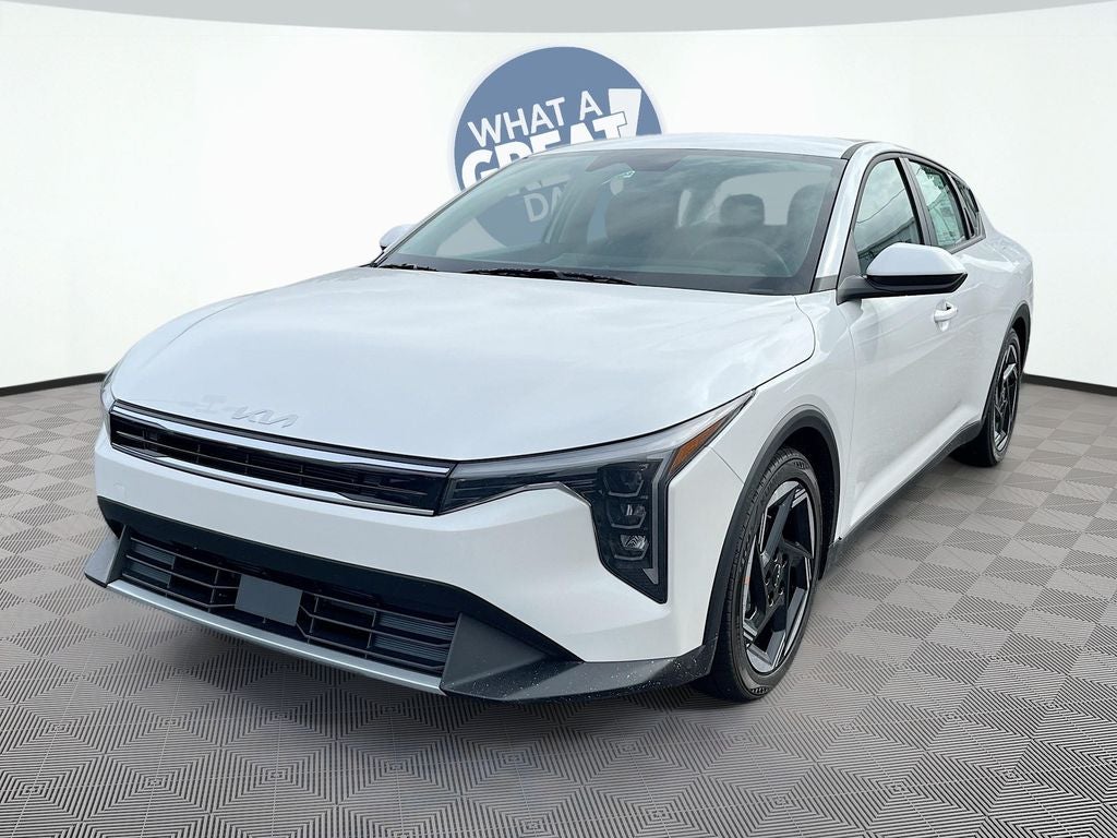 2026 Kia K4 EX in Snow White Pearl — front three-quarter view