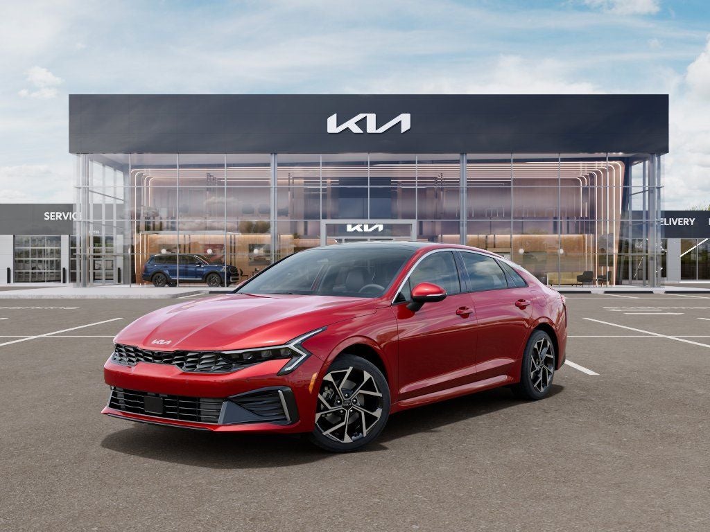2026 Kia K5 EX in Runway Red — front three-quarter view