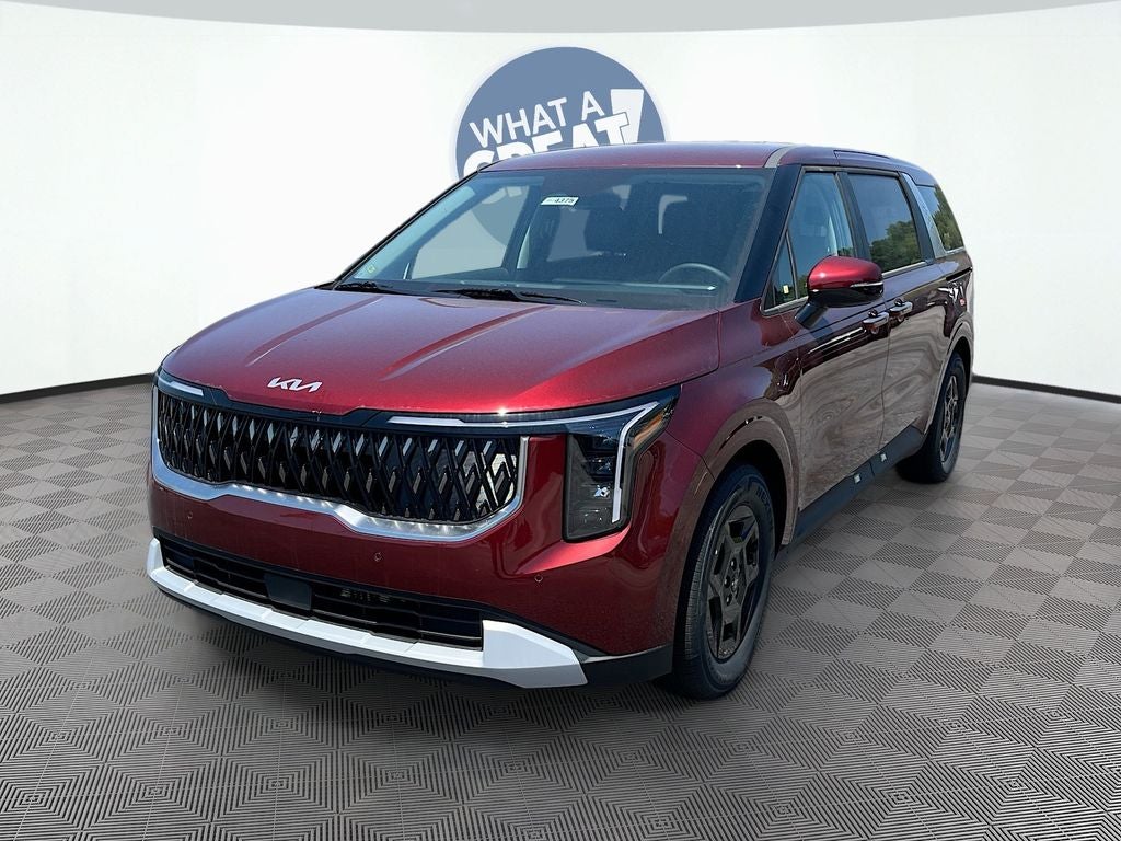 2026 Kia Carnival LXS in Flare Red — front three-quarter view