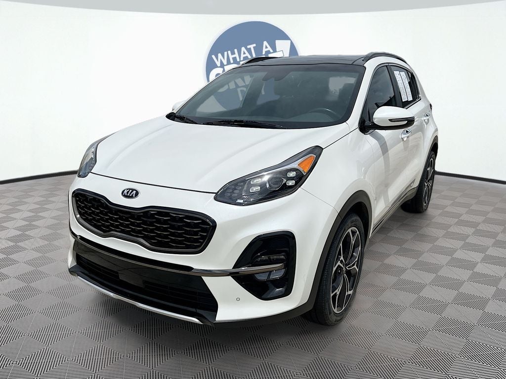 2020 Kia Sportage SX in Snow White Pearl — front three-quarter view